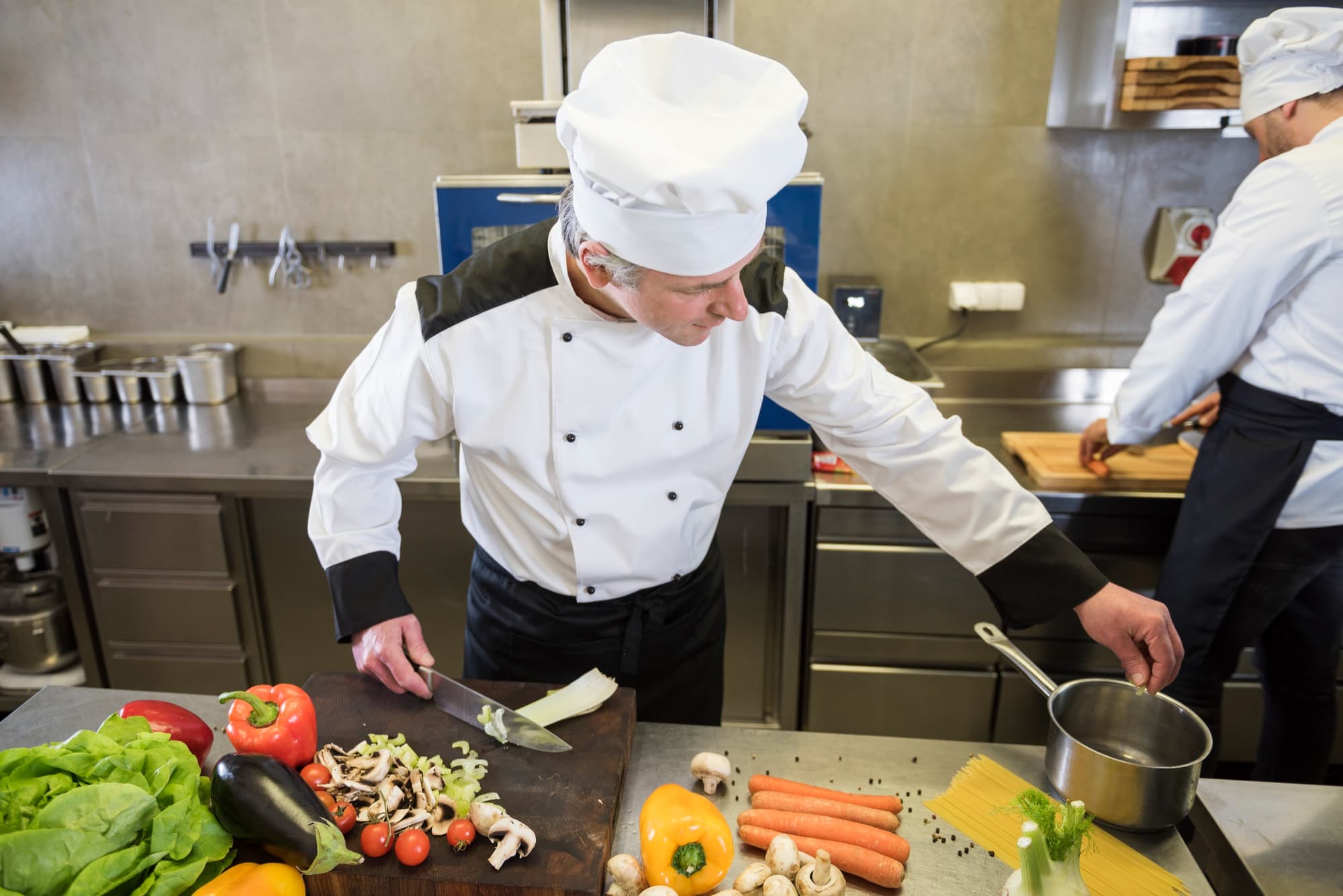 Professional chef preparing food in kitchen